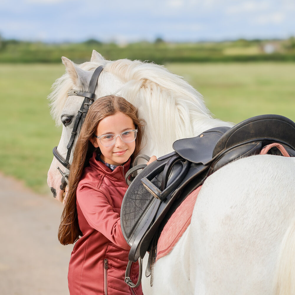 Young rider with her pony